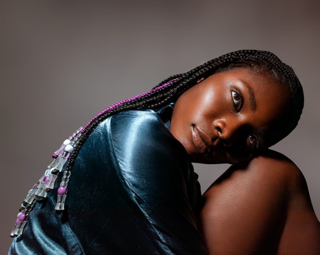 Elegant Black woman with braids showing a polished braided wig look