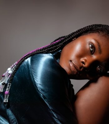 Elegant Black woman with braids showing a polished braided wig look