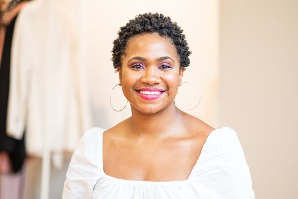 Black woman wearing a short textured twist hairstyle for an easy low-maintenance look