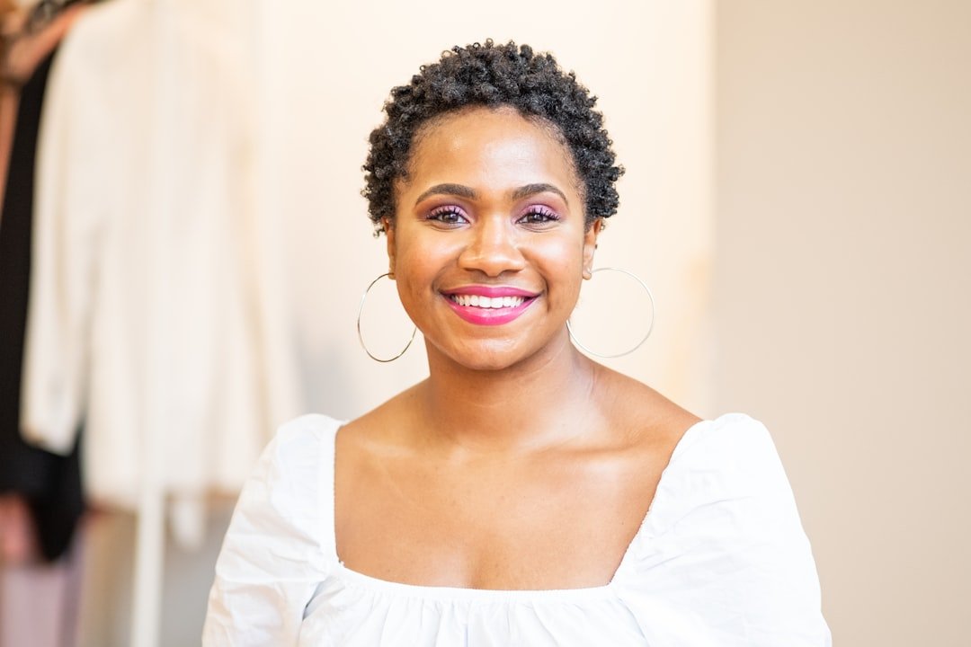Black woman wearing a short textured twist hairstyle for an easy low-maintenance look