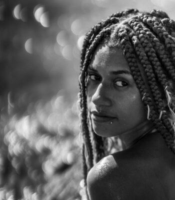 Confident Black woman with braids representing premium braided wig quality and trust